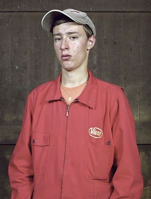 a man wearing a red jacket and a hat