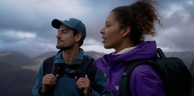 a man and a woman standing next to each other