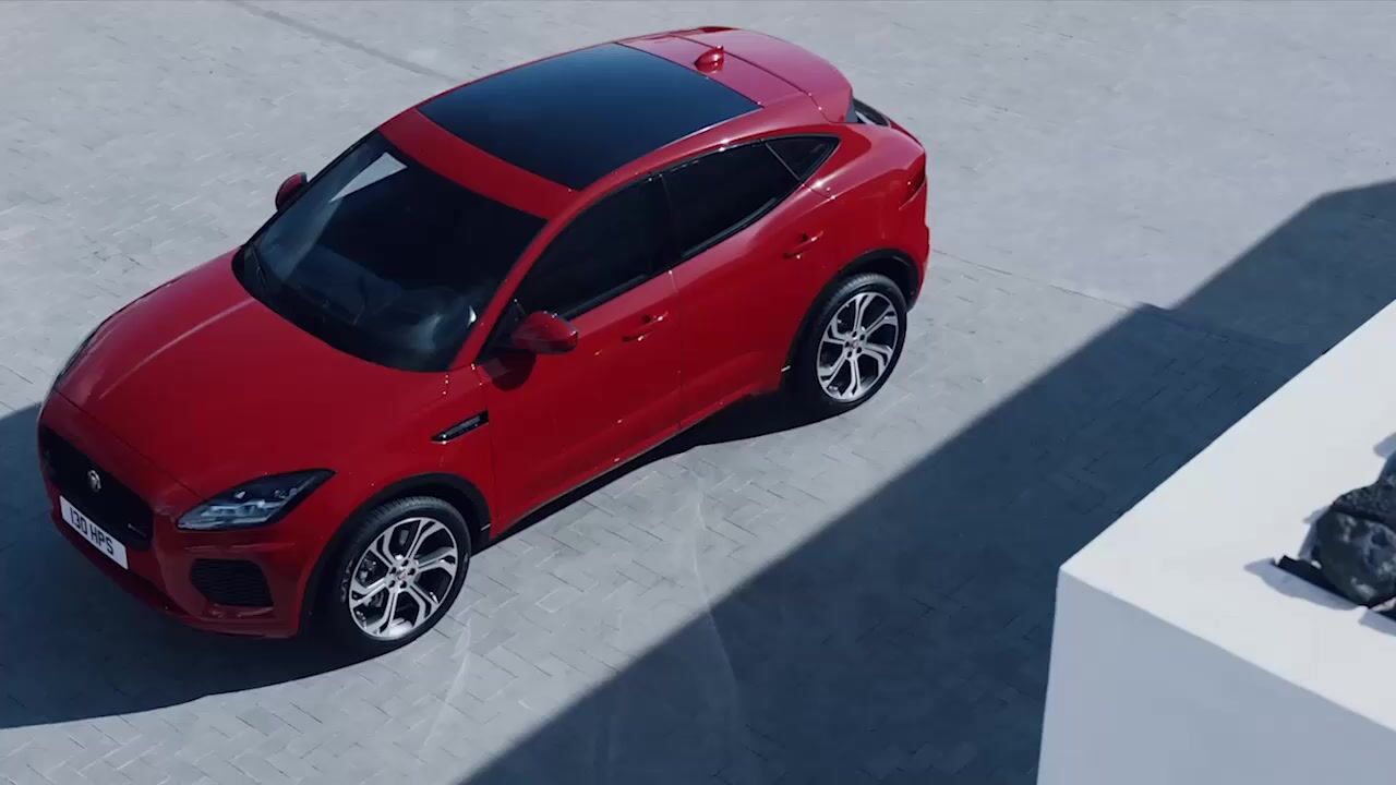 a red car parked in a parking lot