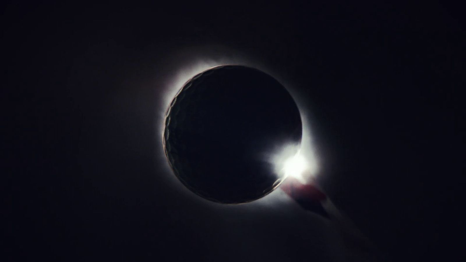 a solar eclipse seen through the dark sky