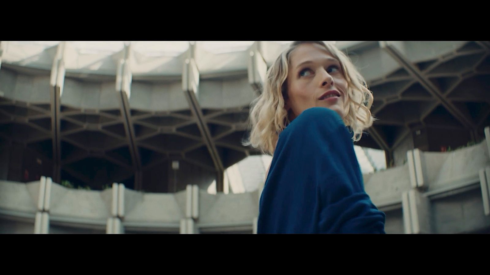 a woman standing in front of a building