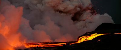 a volcano erupts lava as it erupts into the air