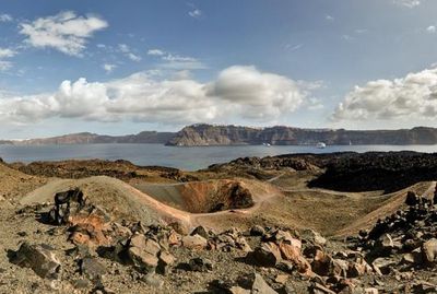 a view of a mountain range with a body of water in the distance