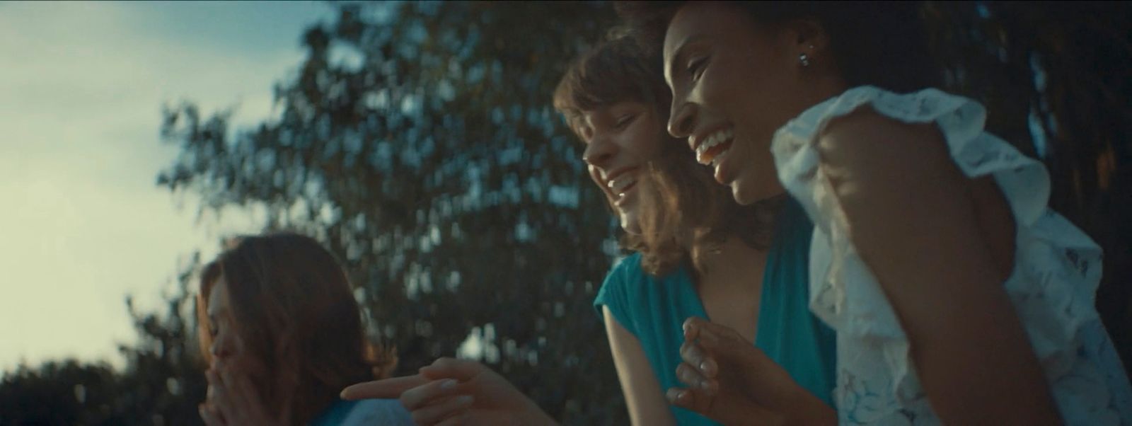 a group of young women standing next to each other