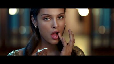 a woman making a funny face while holding a piece of cake