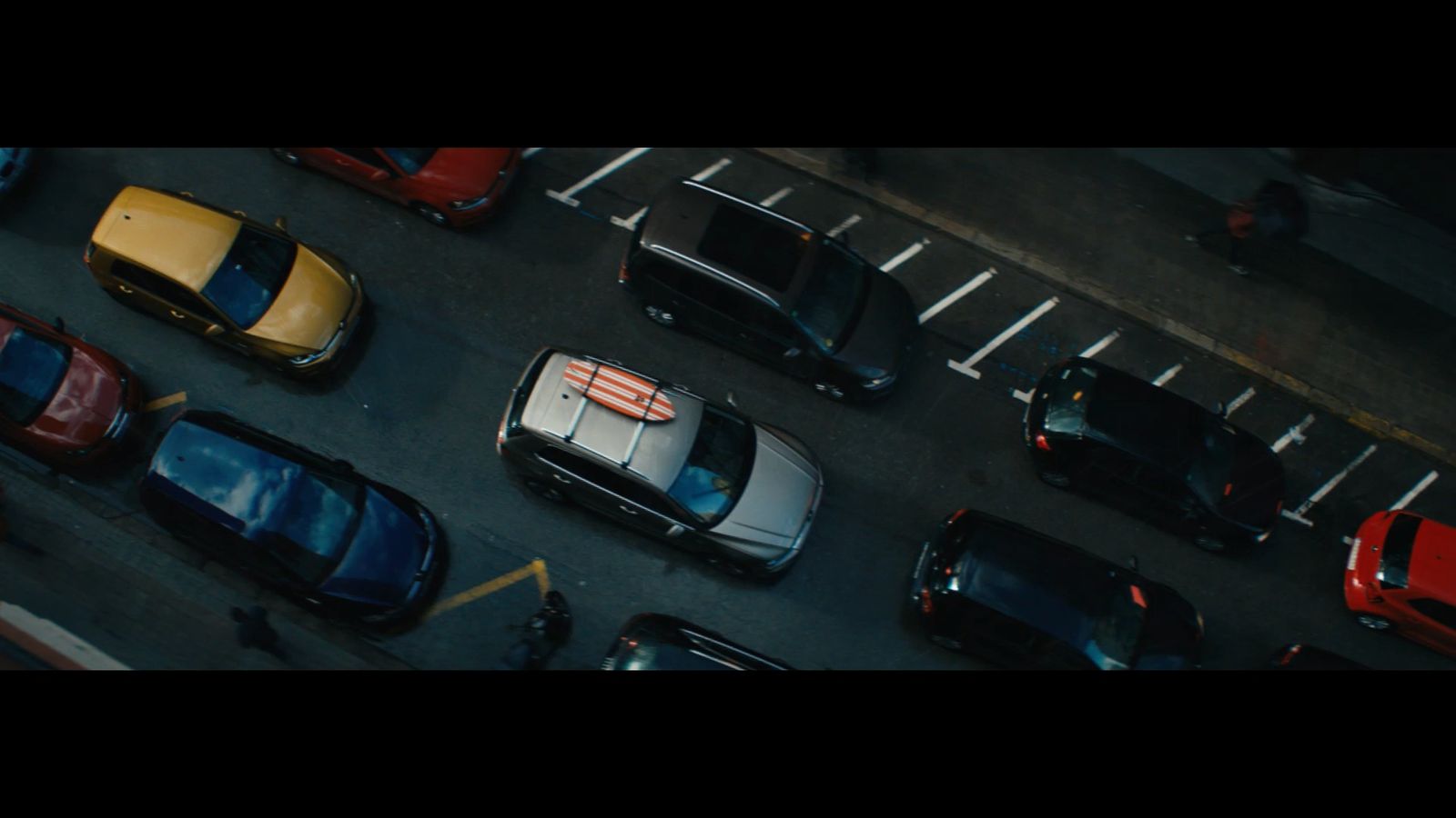 a group of cars parked in a parking lot