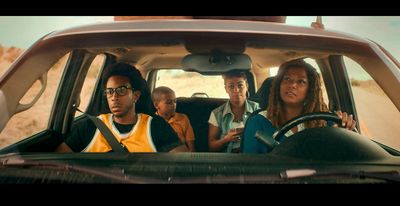 a group of people sitting in the back of a car