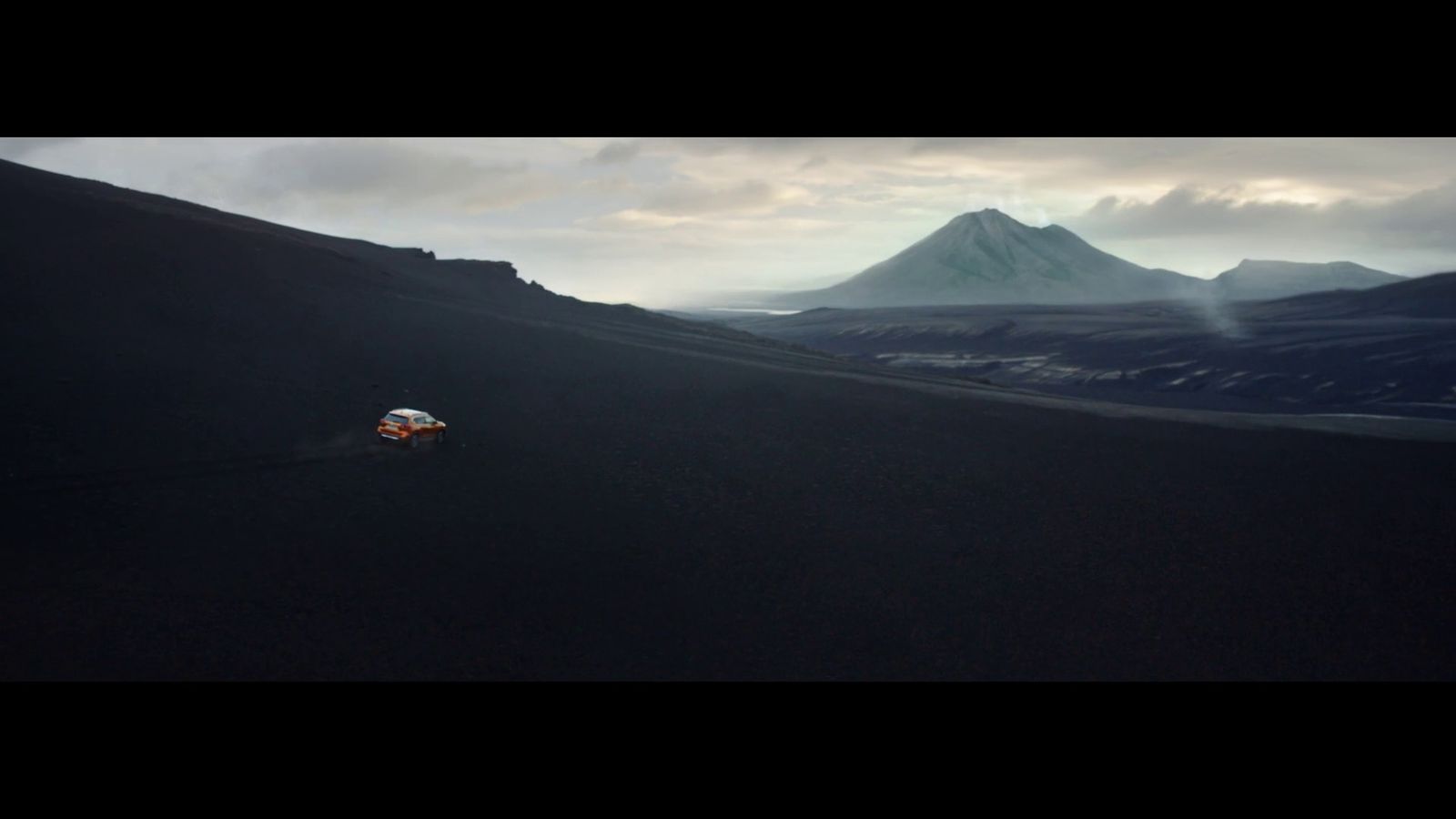 a person riding a motorcycle on top of a hill