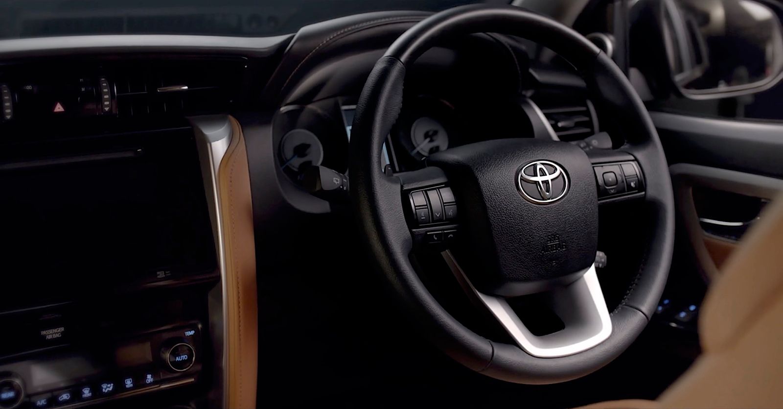 a steering wheel and dashboard of a car