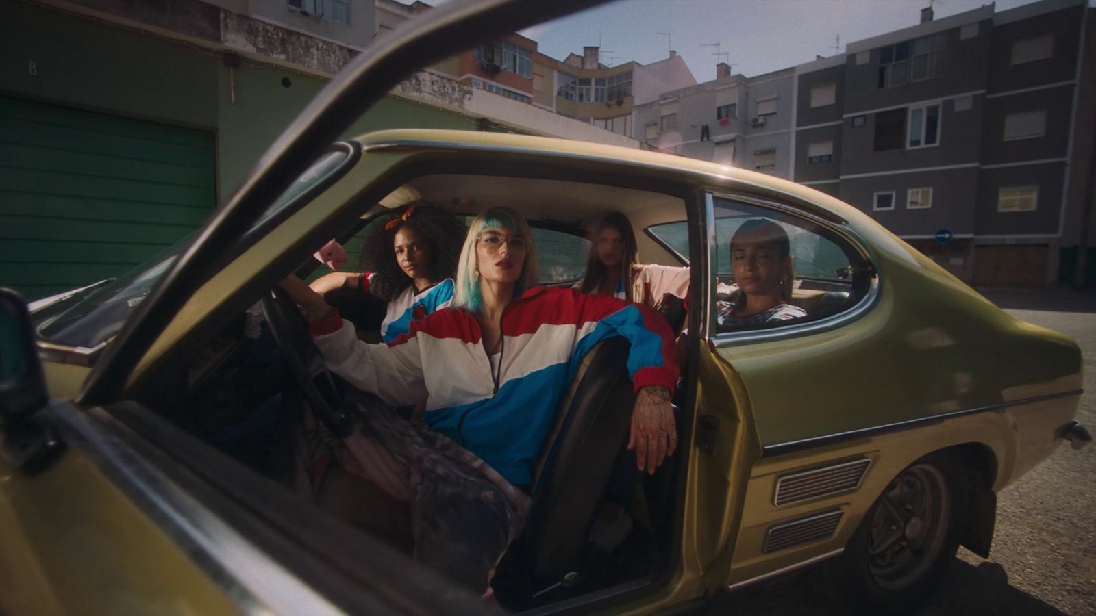 a group of people sitting inside of a car