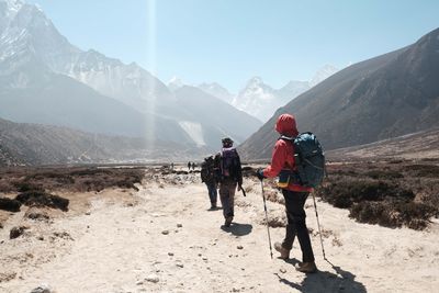 a group of hikers trekking through the mountains