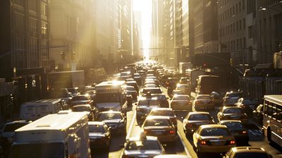 a busy city street filled with lots of traffic