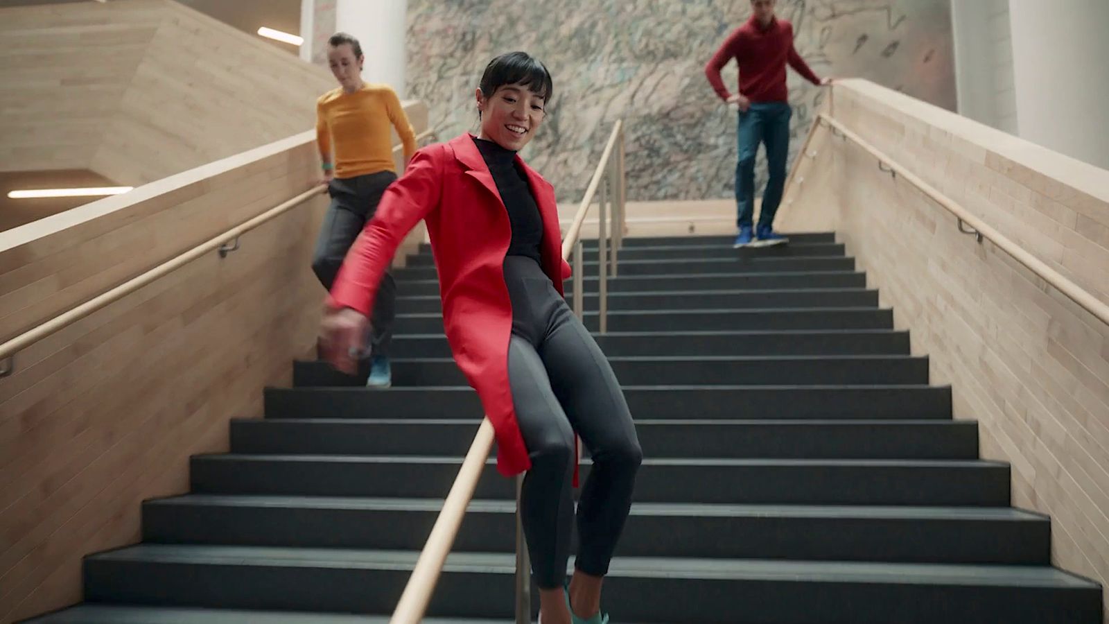 a woman walking down a flight of stairs