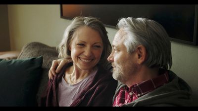 a man and a woman sitting on a couch