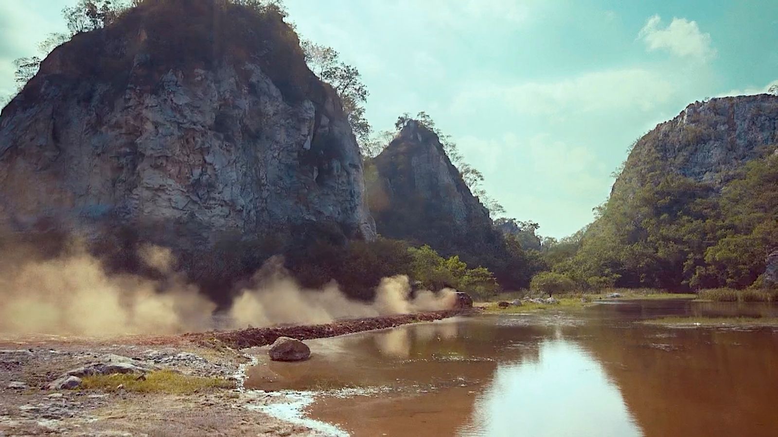 a body of water with steam coming out of it