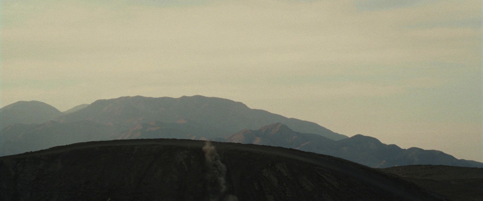 a view of a mountain range from a distance