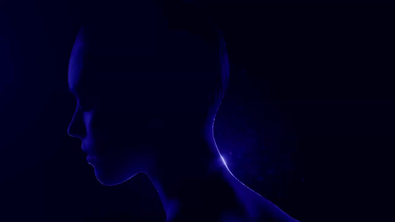 a silhouette of a woman in the dark