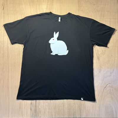a black shirt with a white rabbit on it
