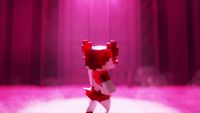 a red and white robot standing on a stage