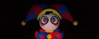 a close up of a toy clown on a black background