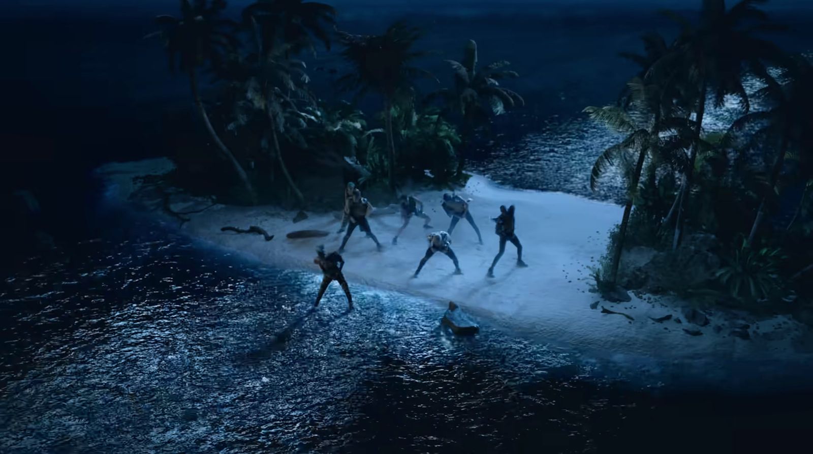 a group of people standing on top of a snow covered beach