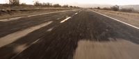 a car driving down a road in the desert