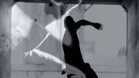 a black and white photo of a person doing a trick on a skateboard