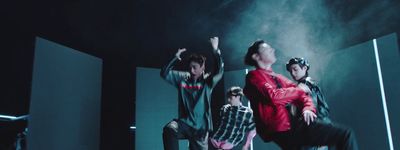 a group of young men standing on top of a stage