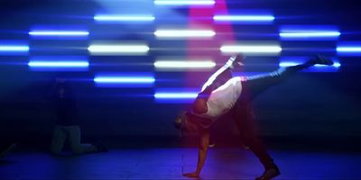 a person doing a handstand on a stage