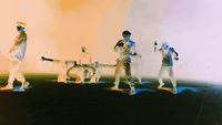 a group of people standing on top of a stage