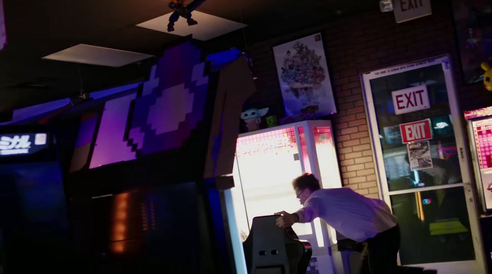 a man standing in front of a machine in a room