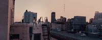 a view of a city skyline from a rooftop