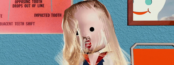 a doll with blonde hair and a red bow tie