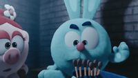 a blue bunny holding a toothbrush next to a blue bunny