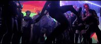 a group of people dancing in a club