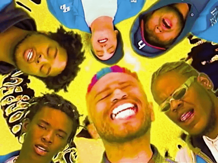 a group of young men standing in a circle