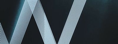 a close up of the letters w and v on a black background