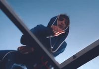 a man flying through the air while riding a skateboard