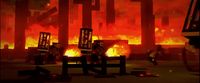 a man sitting on a bench in front of a fire