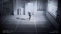 a man walking down a hallway in a building