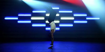 a person doing a handstand on a stage