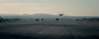 an airplane is taking off from an airport runway