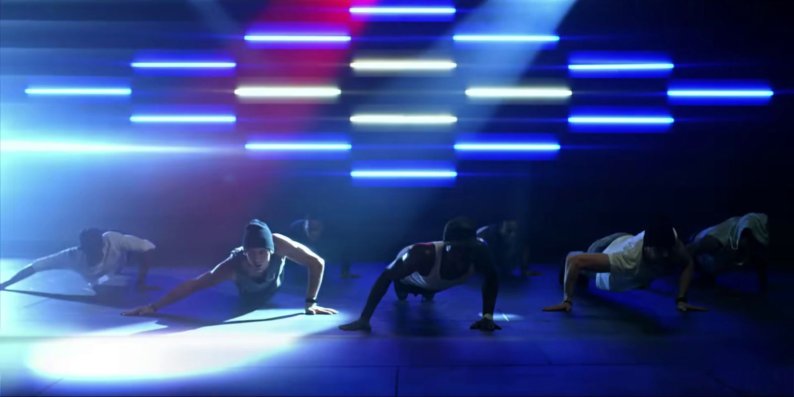 a group of people doing yoga on a stage