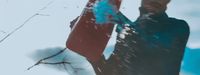 a man holding a snowboard in the snow