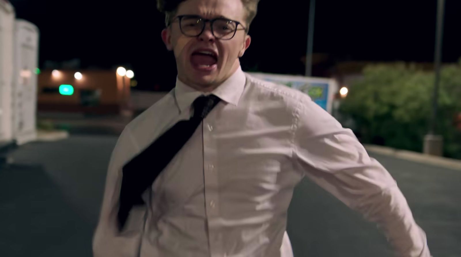 a man in a white shirt and black tie