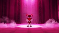 a red and white robot standing on a stage