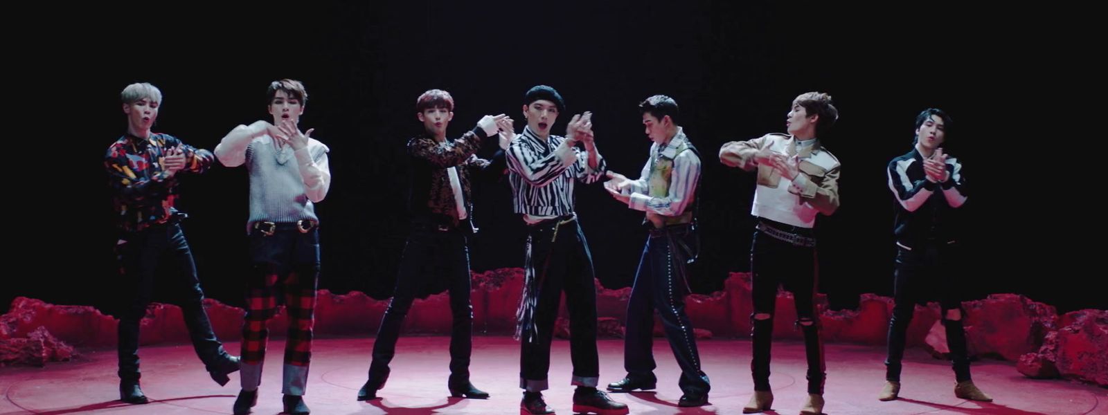 a group of young men standing on top of a stage