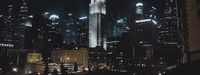 a view of a city at night from a rooftop