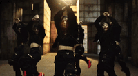 a group of women dressed in black dancing