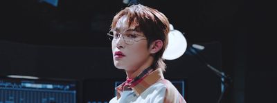 a young man wearing glasses and a bow tie